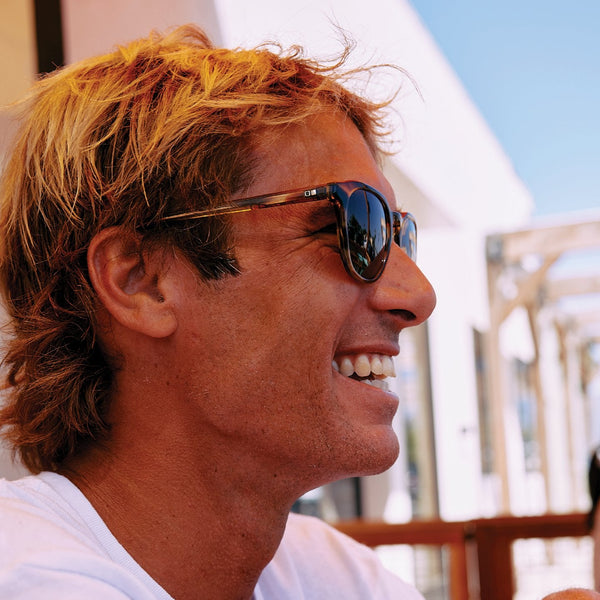 eric geiselman wearing brown tortoise OTIS eyewear sunglasses and smiling